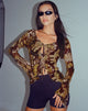 Bild von Sansa Cardi in Schmetterlingsgold