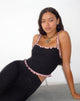 Image of Idalia Korsett-Top in Schwarz mit rosa Mesh-Rüsche