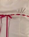  Creme mit rotem Einband
