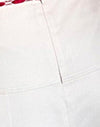Creme mit rotem Einband