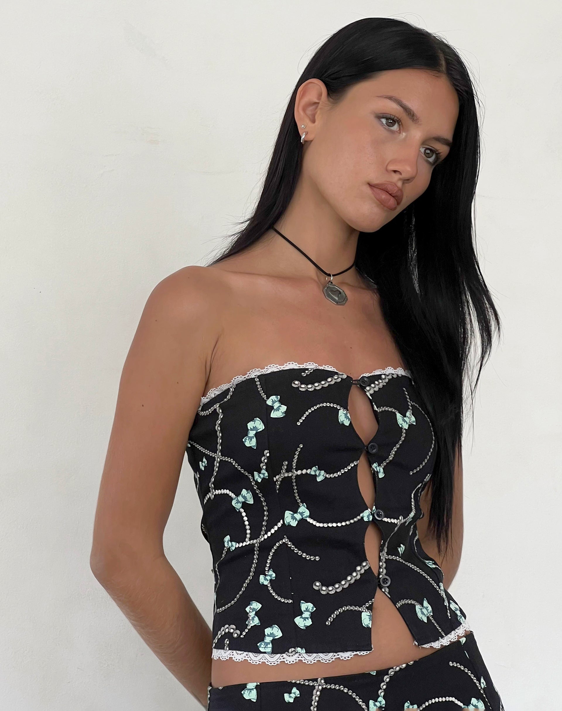 Bild von Lacur Bandeau Korsett in Schwarz mit Perlen- und Schleifenprint