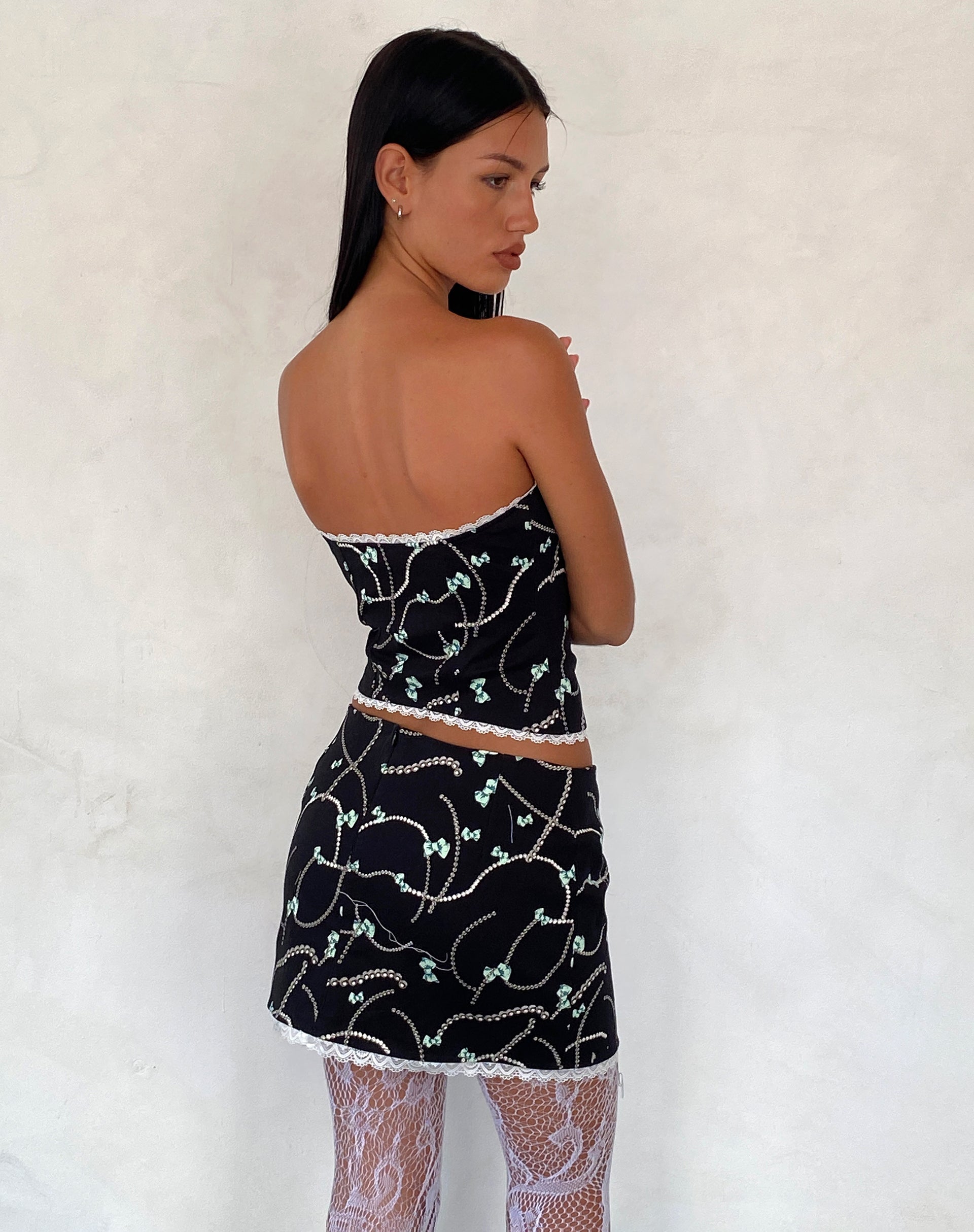 Bild von Lacur Bandeau Korsett in Schwarz mit Perlen- und Schleifenprint
