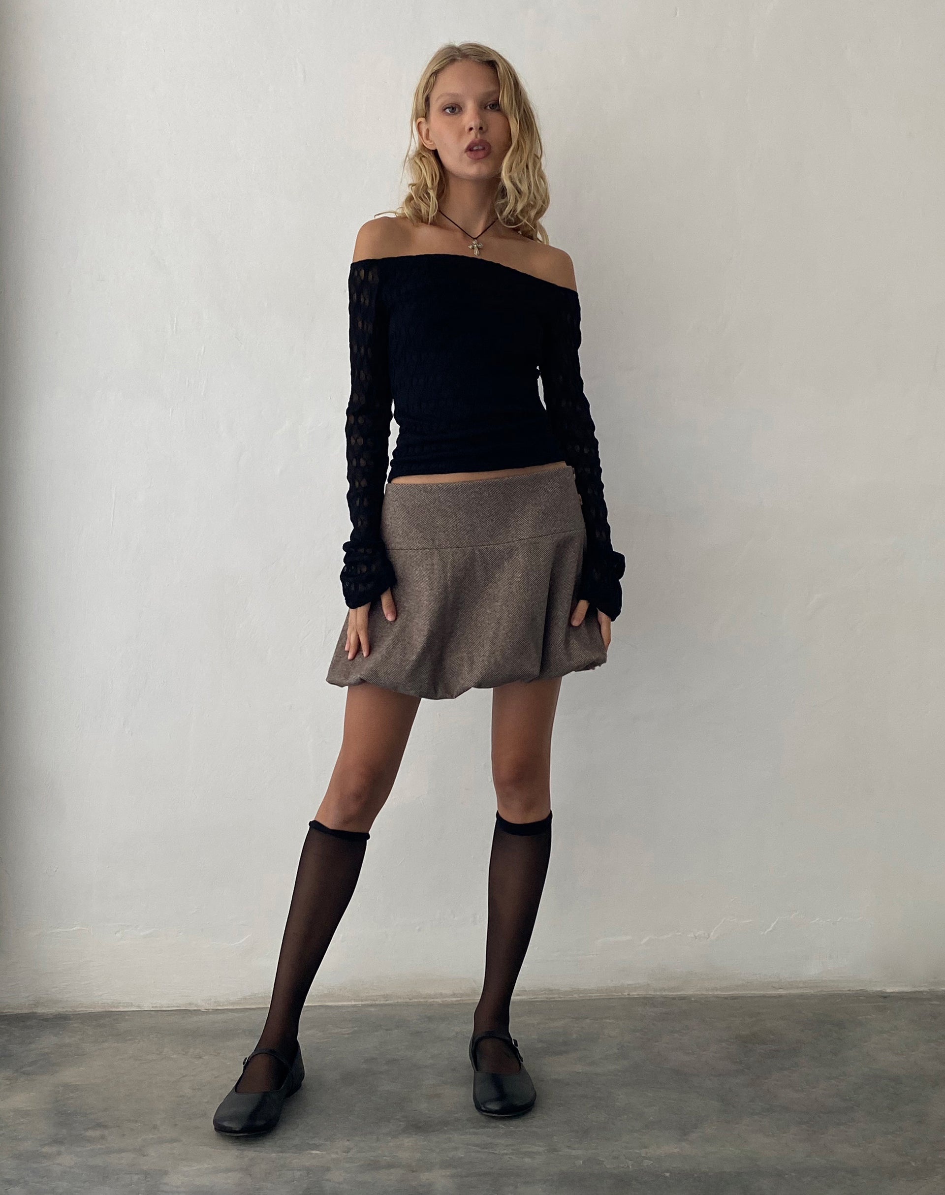 Image of Neira Langärmeliges Bardot-Top aus strukturiertem Strick Schwarz