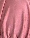 Rosa Schimmer mit schwarzer Schleife