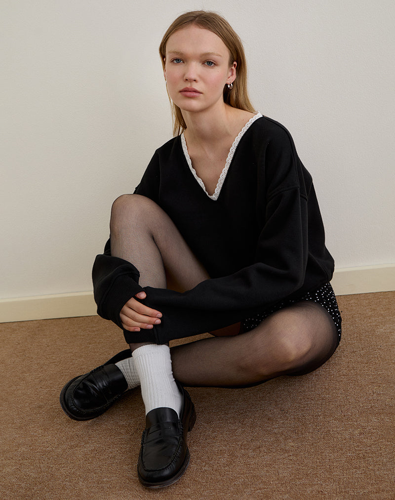 Image of Rodyn Pullover in Schwarz mit weißer Picot-Bindung