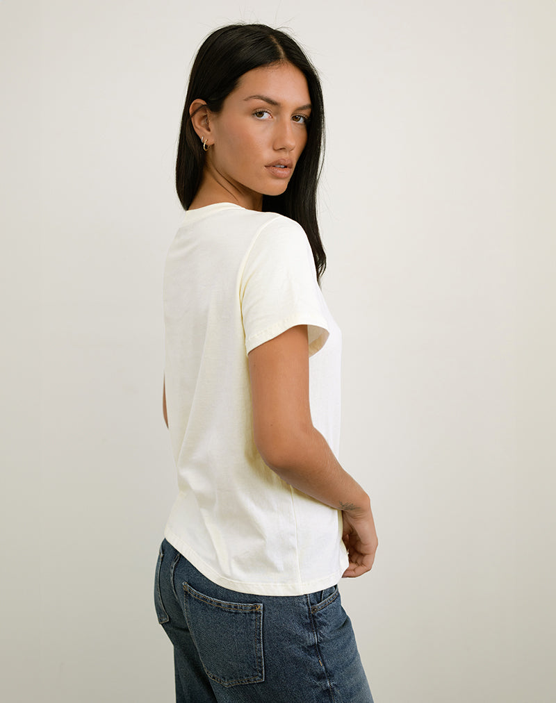 Bild von Saki Tee in Elfenbein mit Upper East Sider Druck