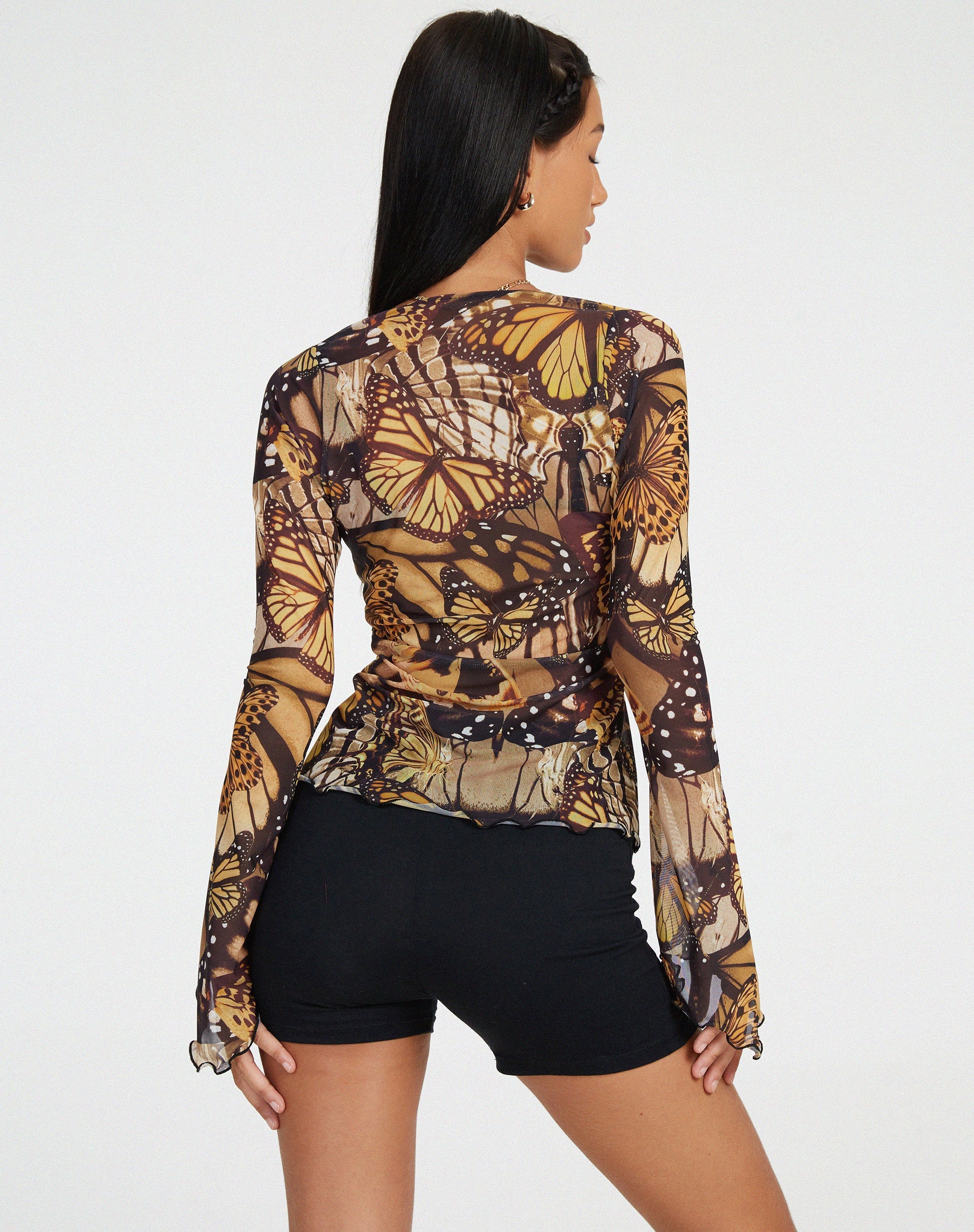 Bild von Sansa Cardi in Schmetterlingsgold