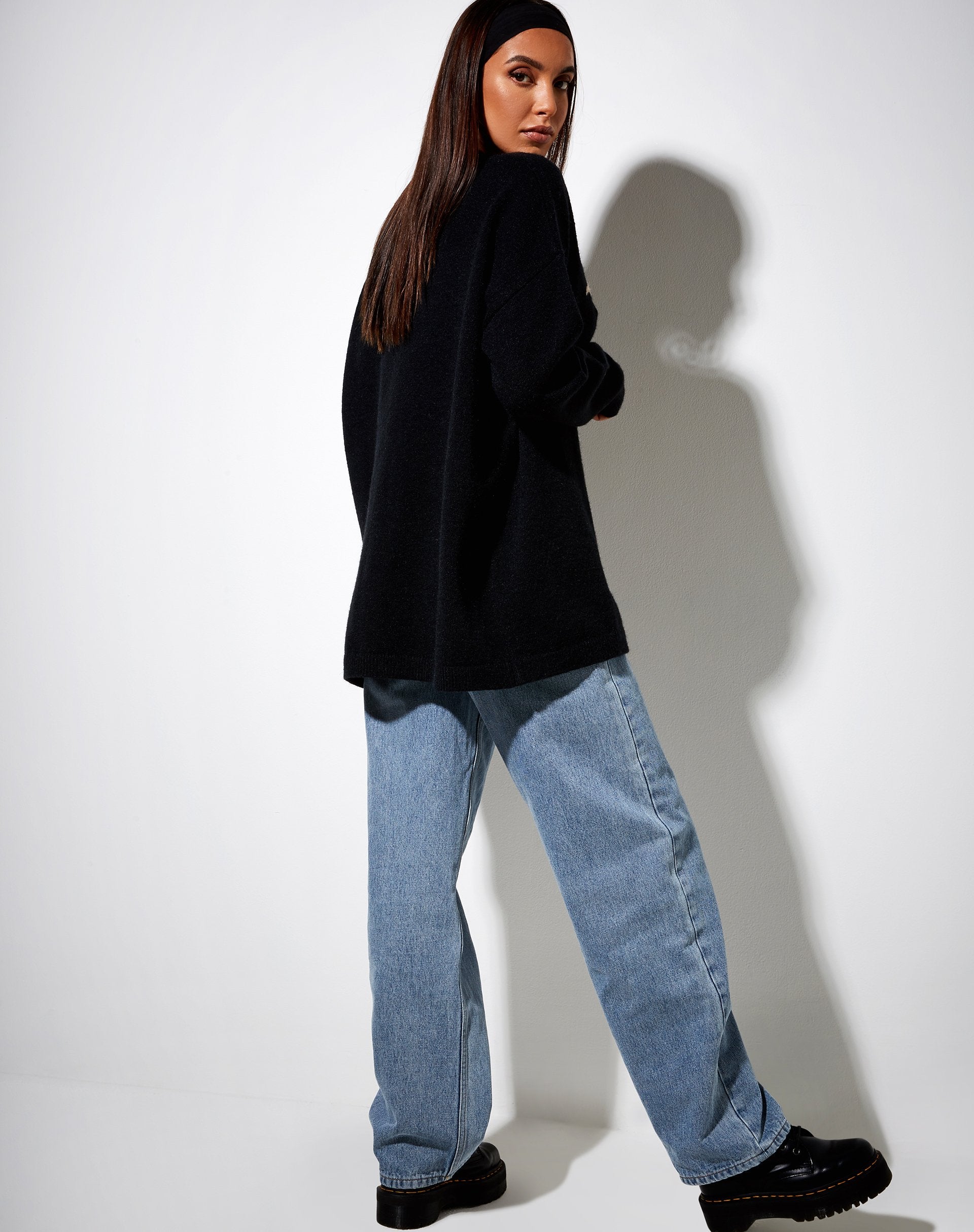 Image of Lulees Pullover aus schwarzem Strick mit Engel in Creme