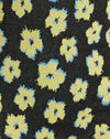 Süßes Blumenmuster in Schwarz und Gelb